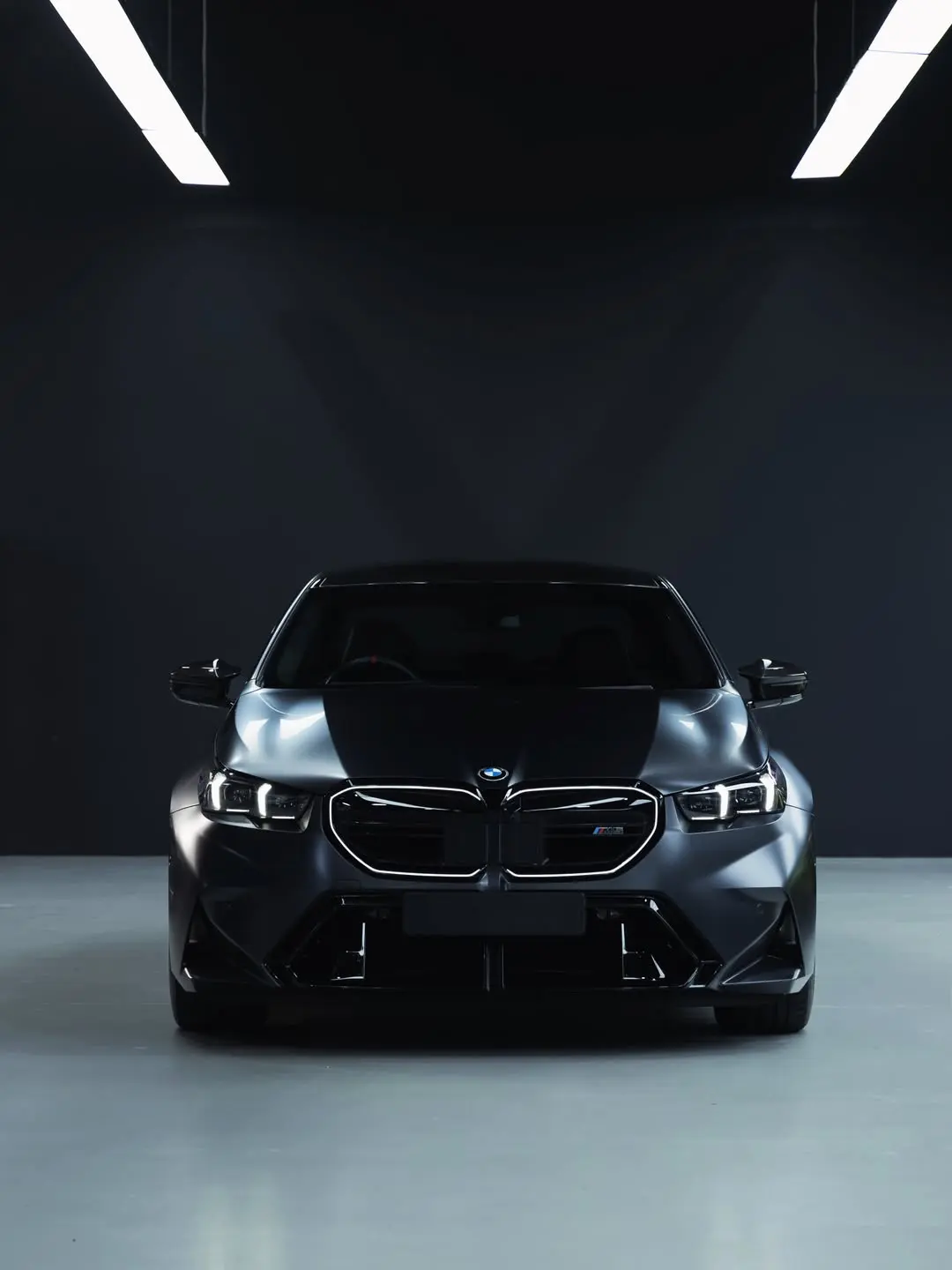 BMW M5, the front of the car in the showroom.