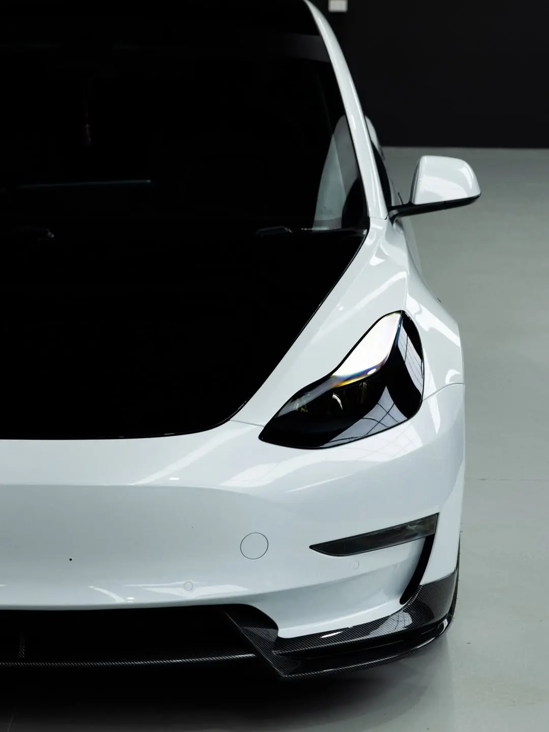 Tesla Model 3, the front quarter and headlight.