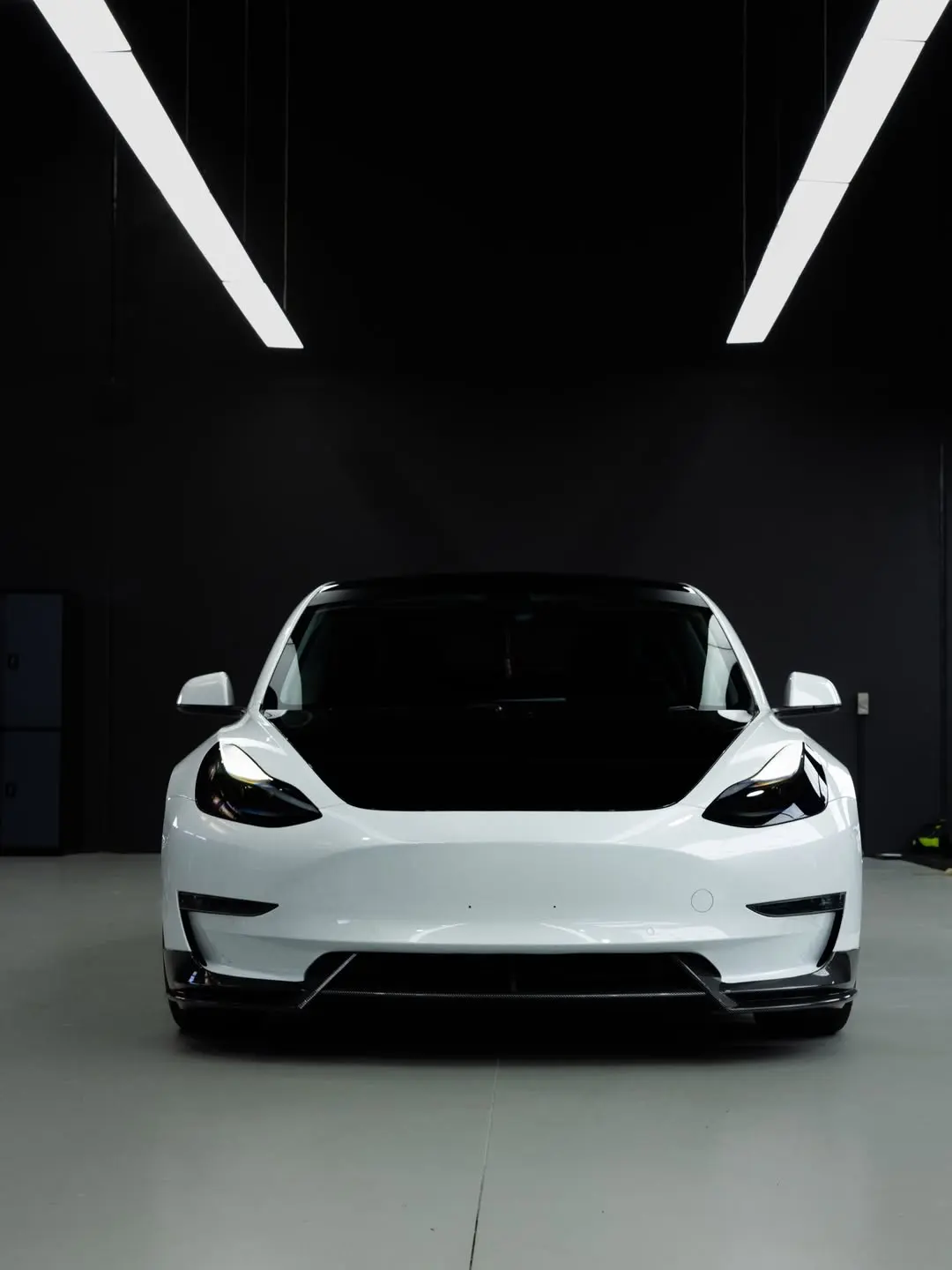 Tesla Model 3, the front of the car in the showroom.