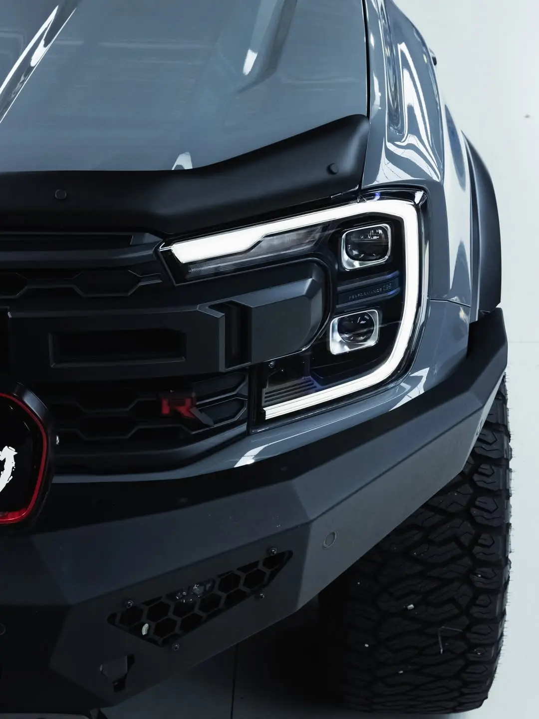 Ford Raptor, the headlight and grille.
