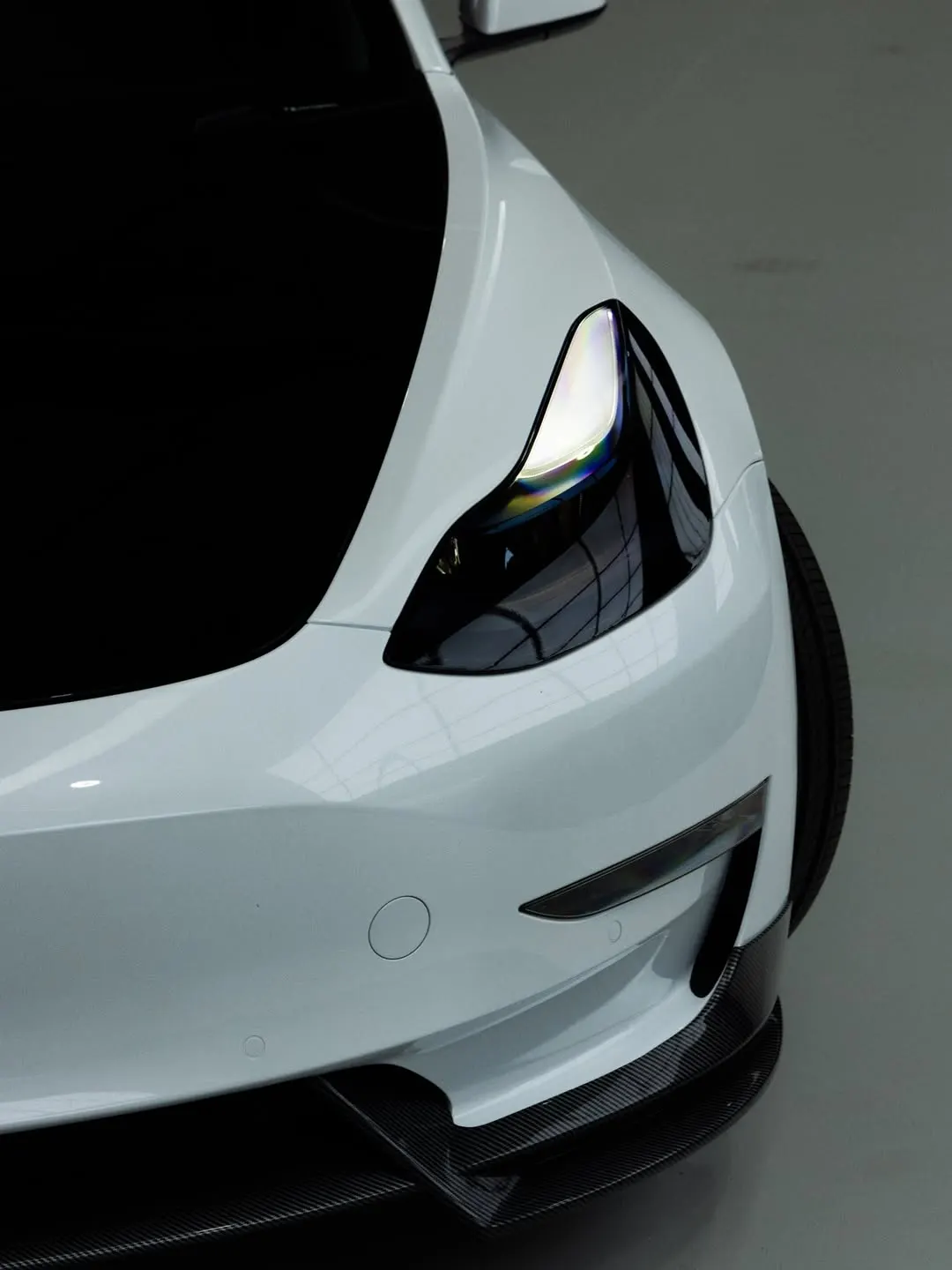 Headlight and front lip of the Tesla Model 3