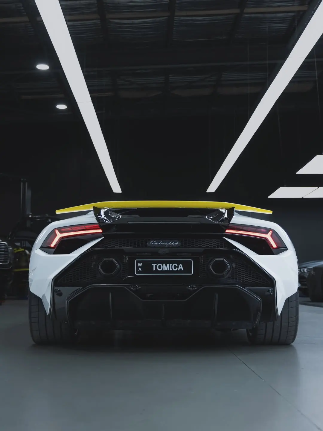 Lamborghini Huracán Tecnica, the rear of the car in the showroom.