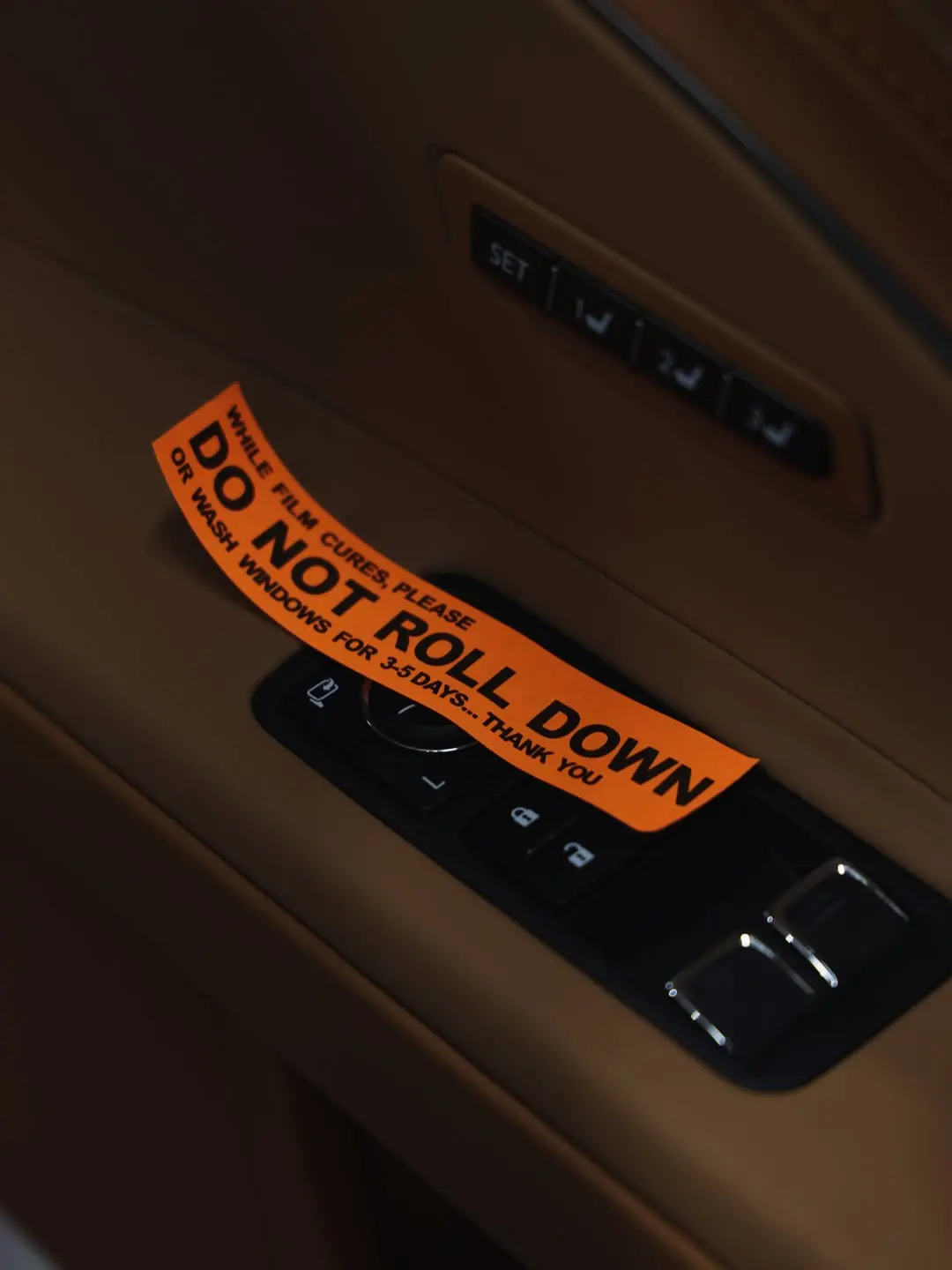 Lexus LC500, the tint notice on the door card.