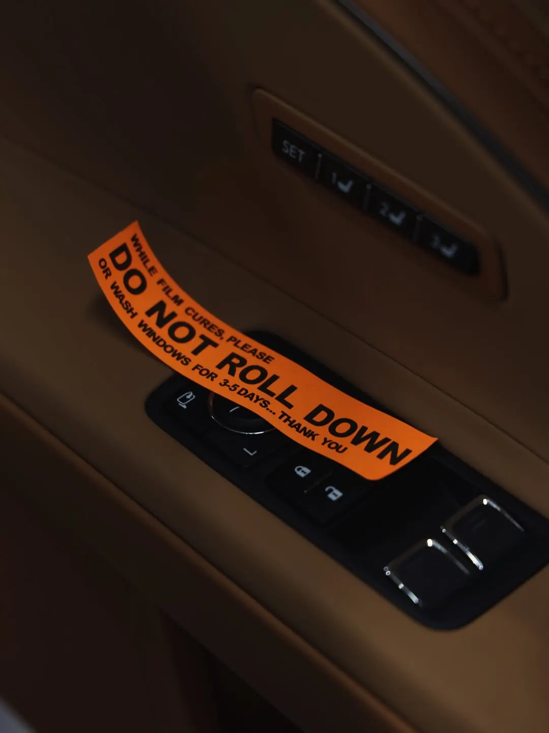 Tint curing notice on the door card of the Lexus LC500