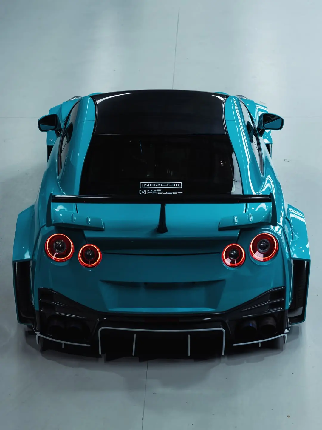 Nissan GT-R R35 Liberty Walk, the rear of the car in the studio.