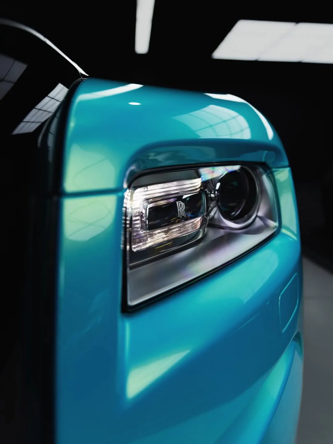 Headlight of the Rolls-Royce Wraith under gloss clear film