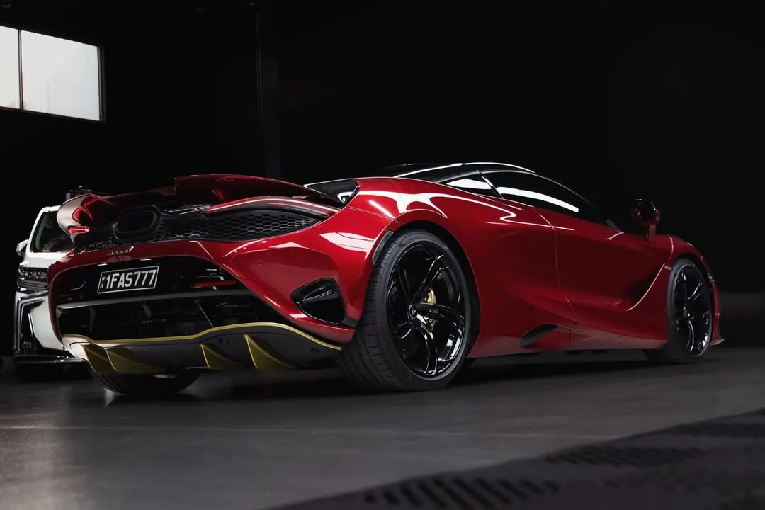 McLaren 750S in deep gloss red under studio lighting