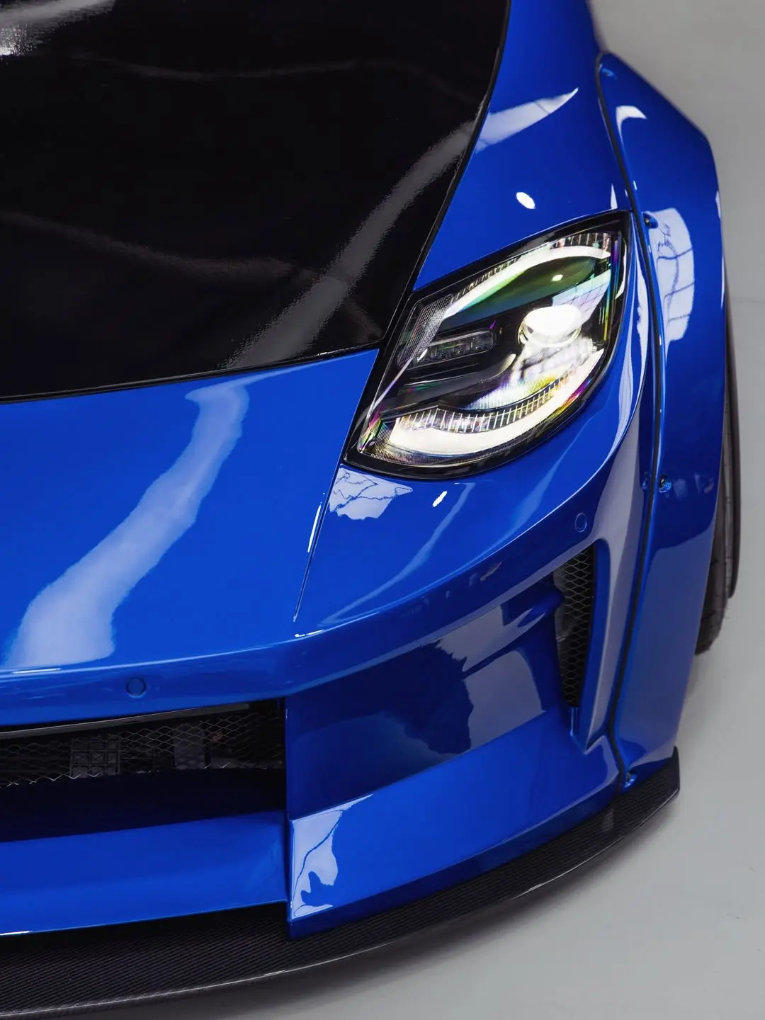 Nissan Z Liberty Walk, the front splitter and headlight.