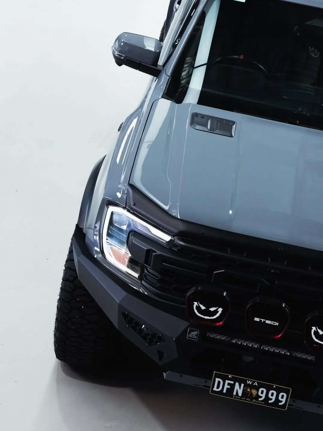 Ford Raptor, the front quarter and driving lights.