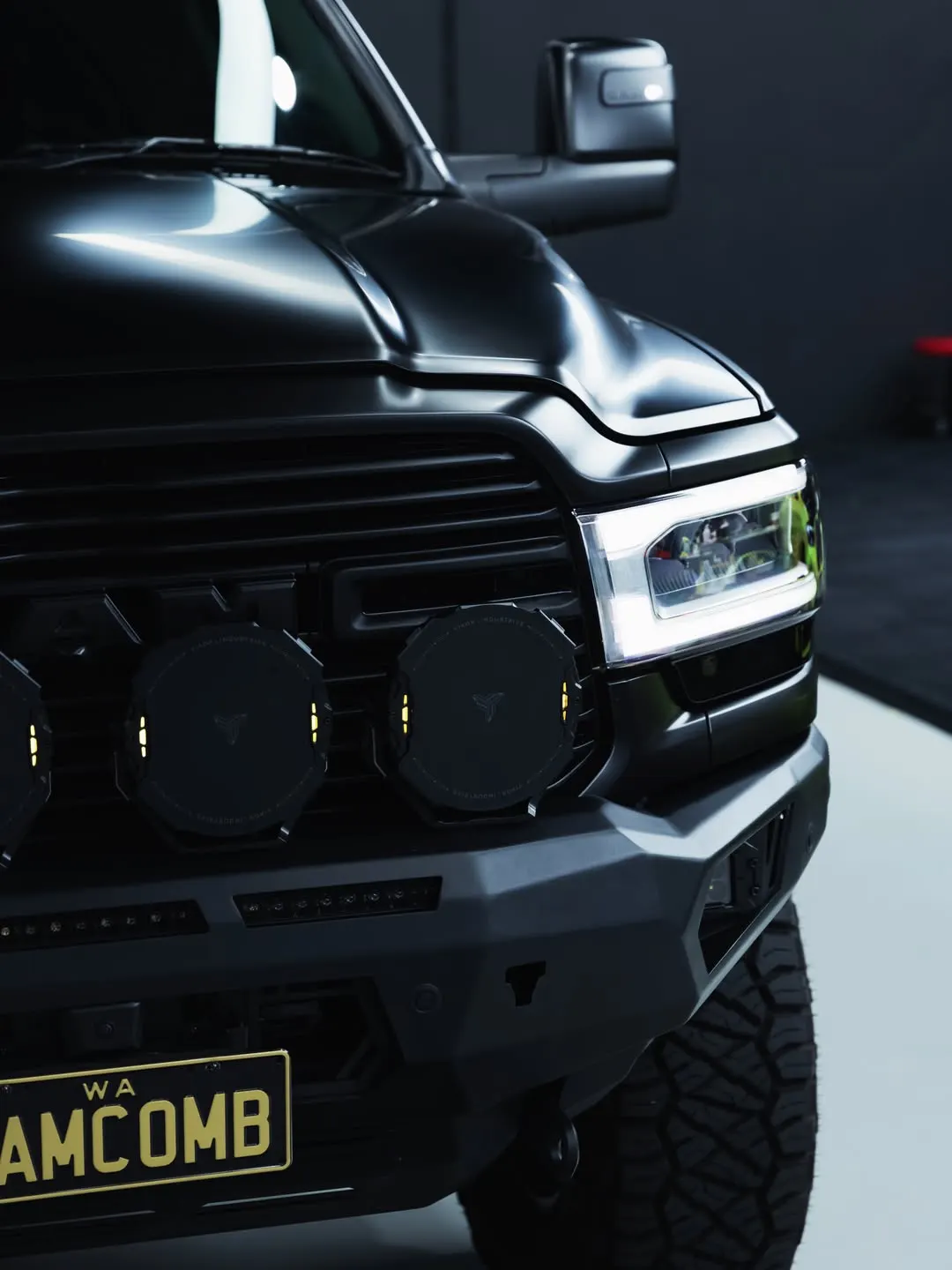 Front quarter of the RAM 2500 with its bull bar and driving lights