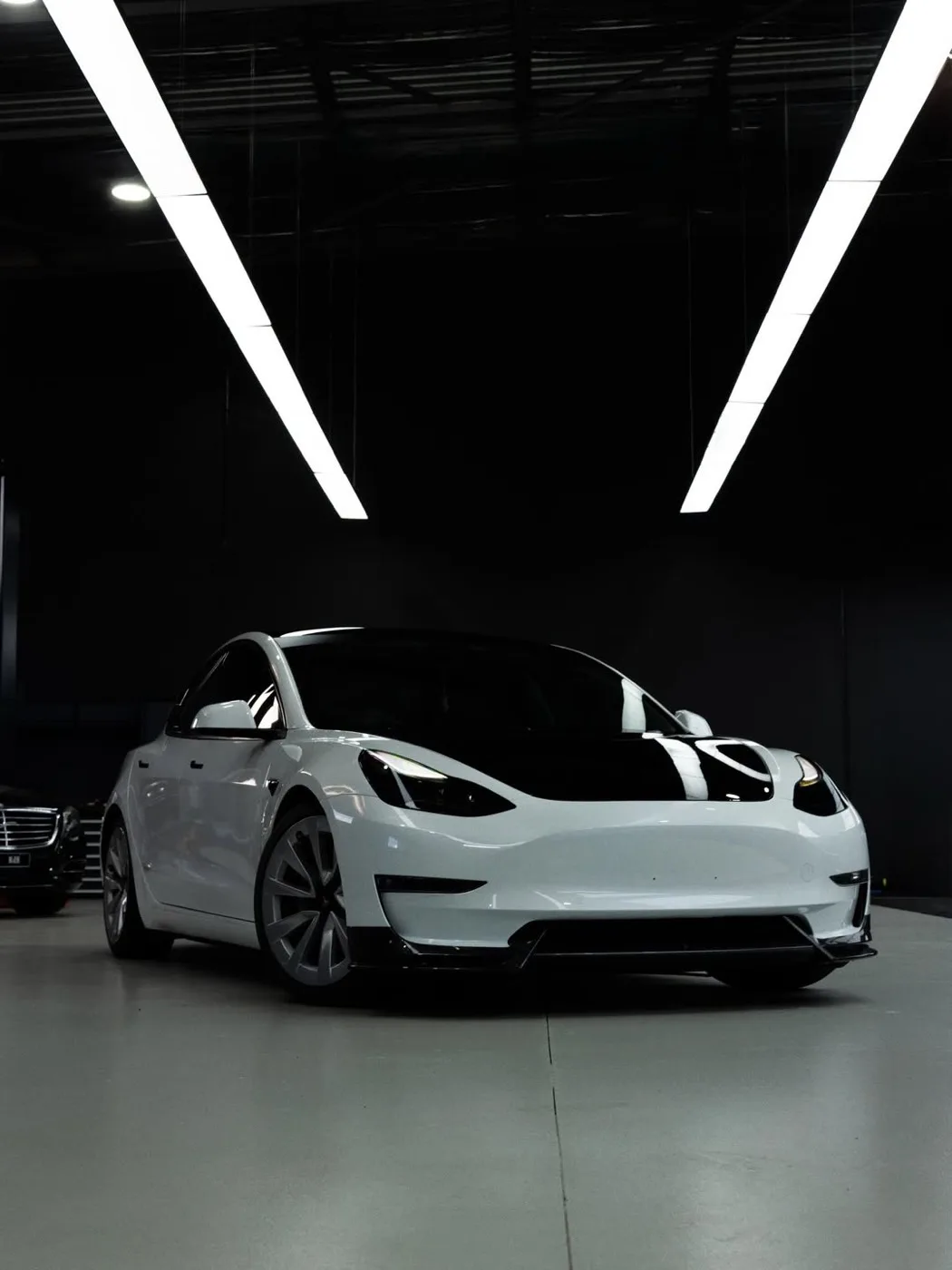 Tesla Model 3 with a gloss black bonnet PPF and window coating